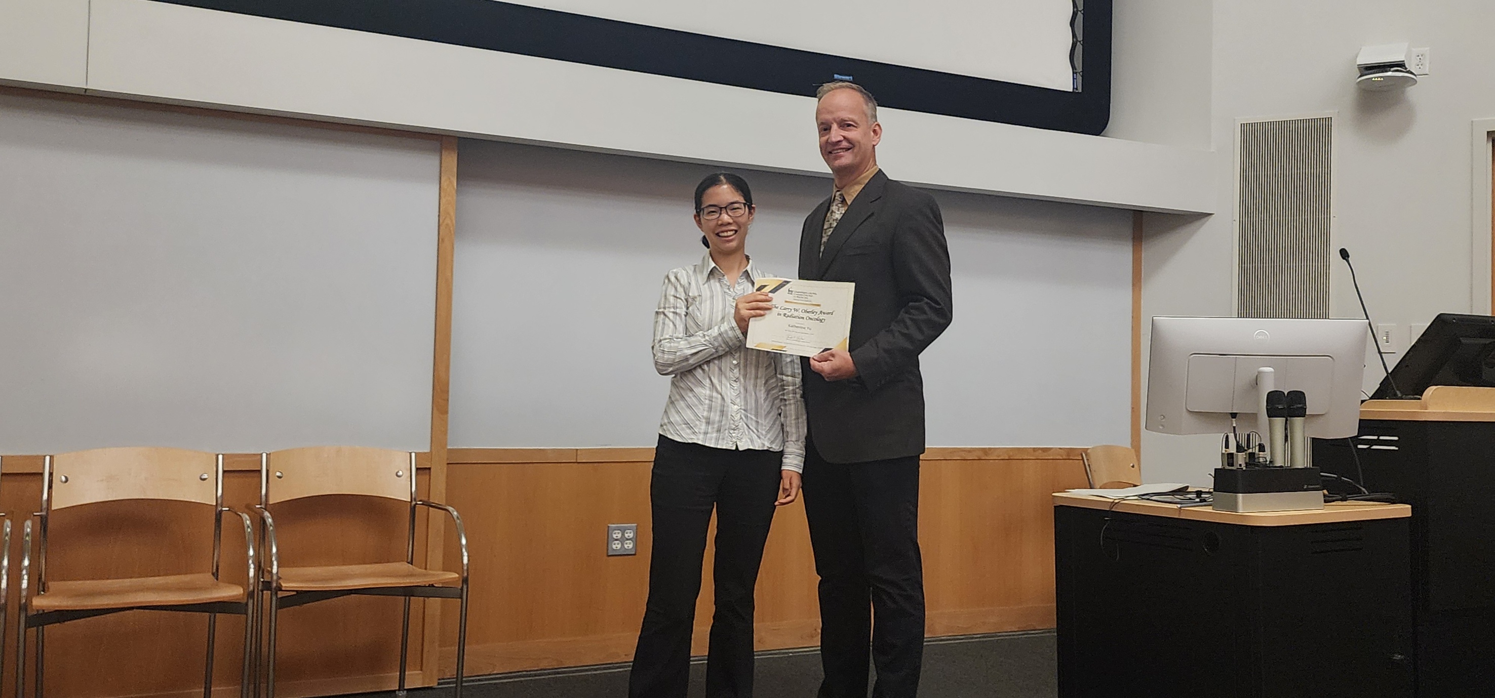 Katherine Yu receiving award